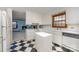 Kitchen with white cabinets and a view of the fireplace at 325 W 13Th St, Salisbury, NC 28144