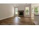 Living room with stone fireplace, hardwood floors, and access to deck at 4271 Candlewood Dr, Sherrills Ford, NC 28673