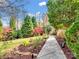 Landscaped backyard with a stone path and lush greenery at 501 W Maryland Ave, Bessemer City, NC 28016