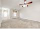 Living room with vaulted ceiling, ceiling fan, and carpeted floor at 545 Weavers Xing, Fort Mill, SC 29715