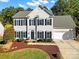 Two-story house with a neutral exterior, two-car garage, and landscaping at 104 White Bridge Ln, Fort Mill, SC 29715