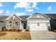 Charming new construction home with stone accents and a two-car garage at 108 N Dunlavin Way # 3, Mooresville, NC 28115