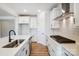 Modern kitchen with white shaker cabinets, stainless steel appliances, and a stylish backsplash at 108 N Dunlavin Way # 3, Mooresville, NC 28115