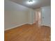 Hardwood floor bedroom with access to hallway at 126 E Division Ave, Salisbury, NC 28144