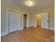 Bedroom with hardwood floors, closets, and access to another room at 126 E Division Ave, Salisbury, NC 28144