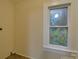 Bright laundry room with tile flooring and window at 126 E Division Ave, Salisbury, NC 28144