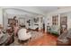 Open living room with hardwood floors and vintage decor at 173 W Pine St, Norwood, NC 28128