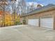 Two-car garage with large concrete driveway at 2618 Forest Lawn Dr, Matthews, NC 28104