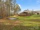 Large backyard with trampoline and wooded area at 700 Top Ridge Ln # 23, Clover, SC 29710