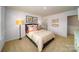 Bedroom with carpeted floor, window, and neutral color palette at 7760 Woolsey Dr, Gastonia, NC 28056