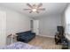 Bedroom with ceiling fan, bed, and couch at 8443 Middleton Cir, Harrisburg, NC 28075