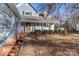 Quaint front exterior with a brick walkway, covered porch, and charming facade at 8443 Middleton Cir, Harrisburg, NC 28075