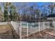 Fenced-in pool with surrounding patio and trees at 8443 Middleton Cir, Harrisburg, NC 28075