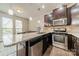 Modern kitchen with granite countertops and stainless steel appliances at 947 Warren Burgess Ln, Charlotte, NC 28205