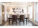 Elegant dining room with crystal chandelier, dark wood table, and neutral decor at 1065 Kinship Dr # 080, Lancaster, SC 29720