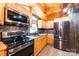 Kitchen boasts stainless steel appliances and wood cabinets at 119 Isaac Rd, Statesville, NC 28625