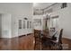 Spacious dining area featuring hardwood floors and built-in cabinetry at 128 Inlet Point Dr, Tega Cay, SC 29708