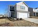 Two-story house with gray siding, white trim, and two-car garage at 217 Aniston Ln, Shelby, NC 28152