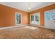 Bright living room with hardwood floors, large windows, and neutral walls at 5198 Old Hickory Rd, Lancaster, SC 29720