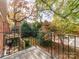 Private balcony overlooking a tree-filled backyard at 5903 Quail Hollow Rd # D, Charlotte, NC 28210