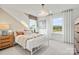 Cozy bedroom with a metal bed frame, light walls, and two windows at 1037 Kinship Dr # 75, Lancaster, SC 29720