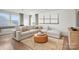 Spacious bonus room with a sectional sofa, large windows, and wood floors at 1037 Kinship Dr # 75, Lancaster, SC 29720