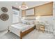 Cozy bedroom with wood framed bed and built-in workspace at 1037 Kinship Dr # 75, Lancaster, SC 29720