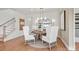 Elegant dining area with a wooden table and white wingback chairs at 1037 Kinship Dr # 75, Lancaster, SC 29720