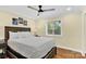 Cozy bedroom with a queen-size bed and wood floors at 11116 Vista Canyon Dr, Charlotte, NC 28226