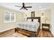 Spacious bedroom with hardwood floors, large windows, and a ceiling fan at 11116 Vista Canyon Dr, Charlotte, NC 28226