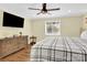Bright bedroom with a dresser, large bed, and a ceiling fan at 11116 Vista Canyon Dr, Charlotte, NC 28226