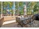 Relaxing deck with patio furniture and umbrella, offering a shaded outdoor space at 11116 Vista Canyon Dr, Charlotte, NC 28226