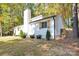 White house exterior with wood accents, landscaping, and a large yard at 11116 Vista Canyon Dr, Charlotte, NC 28226