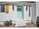 Charming front door with light teal color, wood shutters, and lanterns at 11116 Vista Canyon Dr, Charlotte, NC 28226