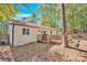 Back of house with deck, showcasing a large backyard and wooded area at 11116 Vista Canyon Dr, Charlotte, NC 28226