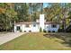 Newly renovated white house with a spacious yard and driveway at 11116 Vista Canyon Dr, Charlotte, NC 28226