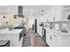 Modern kitchen with white cabinets and a large island at 11116 Vista Canyon Dr, Charlotte, NC 28226