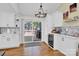 Modern kitchen with white cabinets, wine cooler, and access to deck at 11116 Vista Canyon Dr, Charlotte, NC 28226