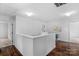 Upstairs hallway with dark hardwood floors and access to bedrooms at 1124 Woodwinds Dr, Waxhaw, NC 28173