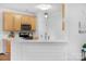 Modern kitchen with light wood cabinets and white countertops at 1124 Woodwinds Dr, Waxhaw, NC 28173