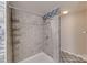 Bathroom with tiled shower and decorative floor at 14035 Lawrence Farm Ln, Charlotte, NC 28278