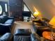 Cozy living room with brick fireplace and leather furniture at 2484 Shelton Ave, Statesville, NC 28677