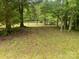 Serene view of a pond from a grassy area, offering a peaceful and tranquil setting at 2484 Shelton Ave, Statesville, NC 28677
