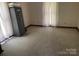 Empty carpeted bedroom with a gun safe at 2484 Shelton Ave, Statesville, NC 28677