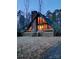 A-frame house with a large window and deck at 2484 Shelton Ave, Statesville, NC 28677