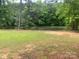 Peaceful pond view surrounded by lush greenery, creating a tranquil atmosphere at 2484 Shelton Ave, Statesville, NC 28677