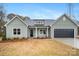 New construction farmhouse exterior at 3007 Buffett Ln, Monroe, NC 28110