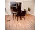 Dining area with a small table and four chairs near sliding glass doors at 5112 Green Leaf Ct, Mount Holly, NC 28120