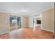 Living room with sliding doors to backyard and view of shed at 5112 Green Leaf Ct, Mount Holly, NC 28120