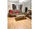 Spacious living room featuring two brown leather sofas and a coffee table at 5112 Green Leaf Ct, Mount Holly, NC 28120